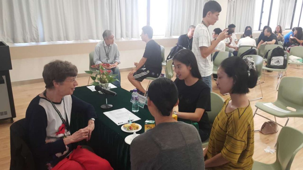 Professor Roberts talks with students