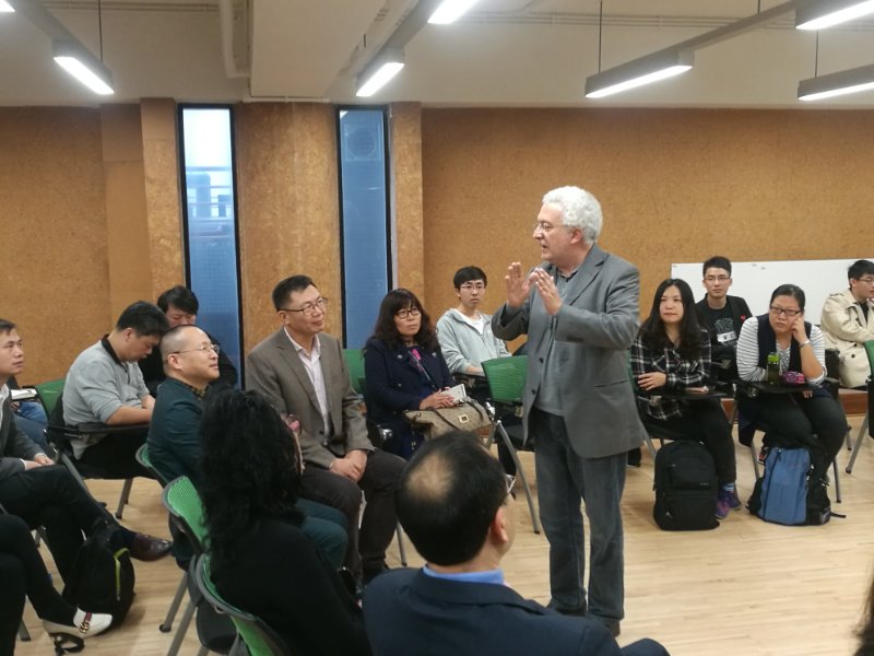 There is a vigorous discussion between the students and their teachers