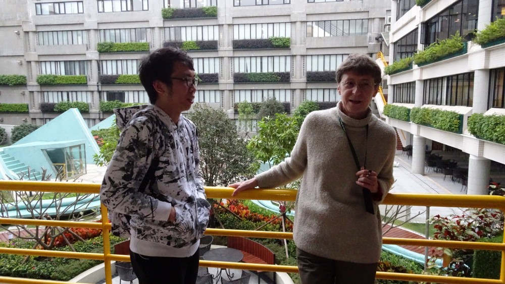 The students converses with Professor Priscilla Roberts