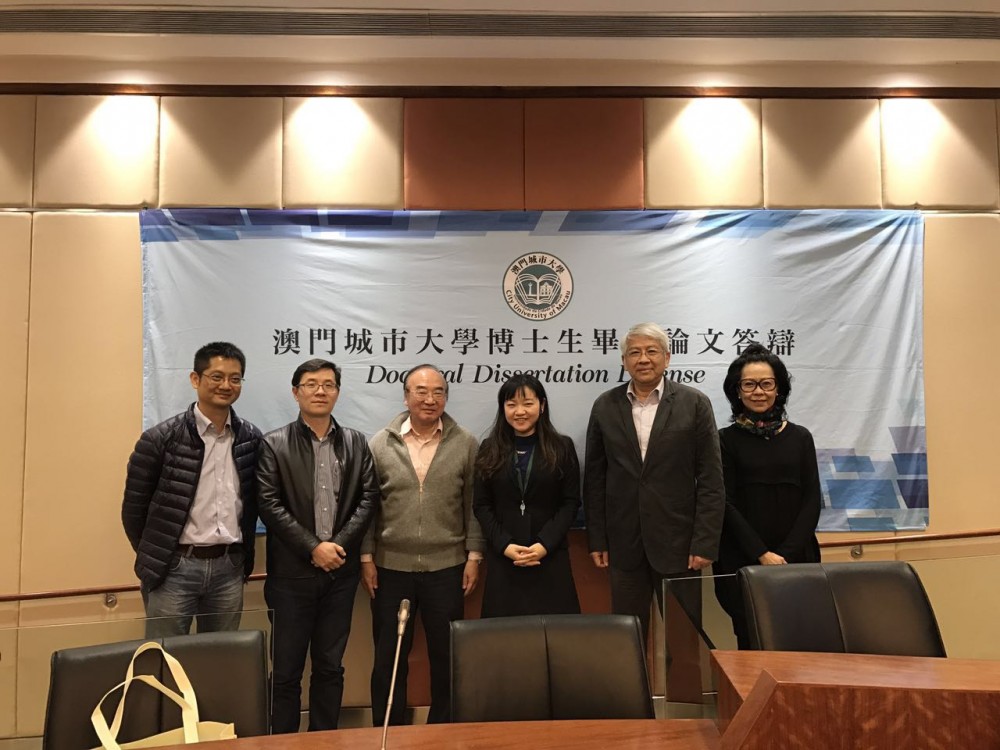 Group photo taken with Xia Changlan, the doctoral candidate, Rector Zhang and Oral Defense Committee
