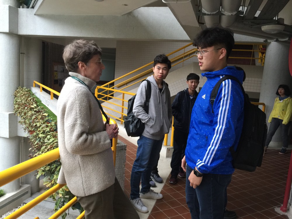 The students converses with Professor Priscilla Roberts