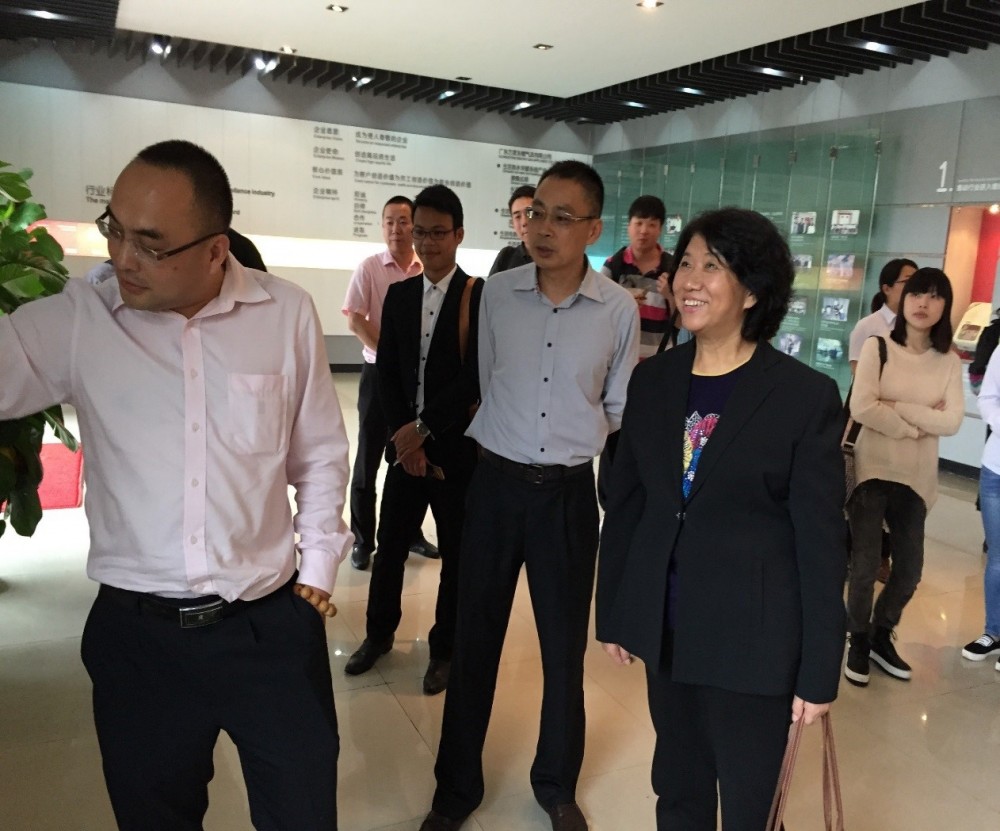 The delegation listening to product updates in the China Macro Pavilion