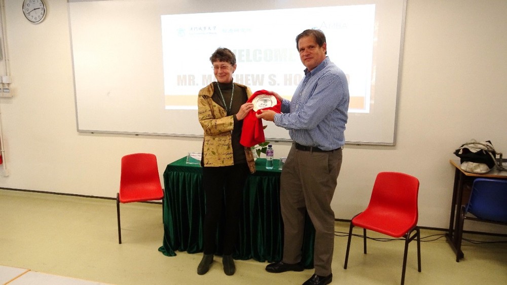 Professor Roberts presents a souvenir to Mr. Matthew Hosford