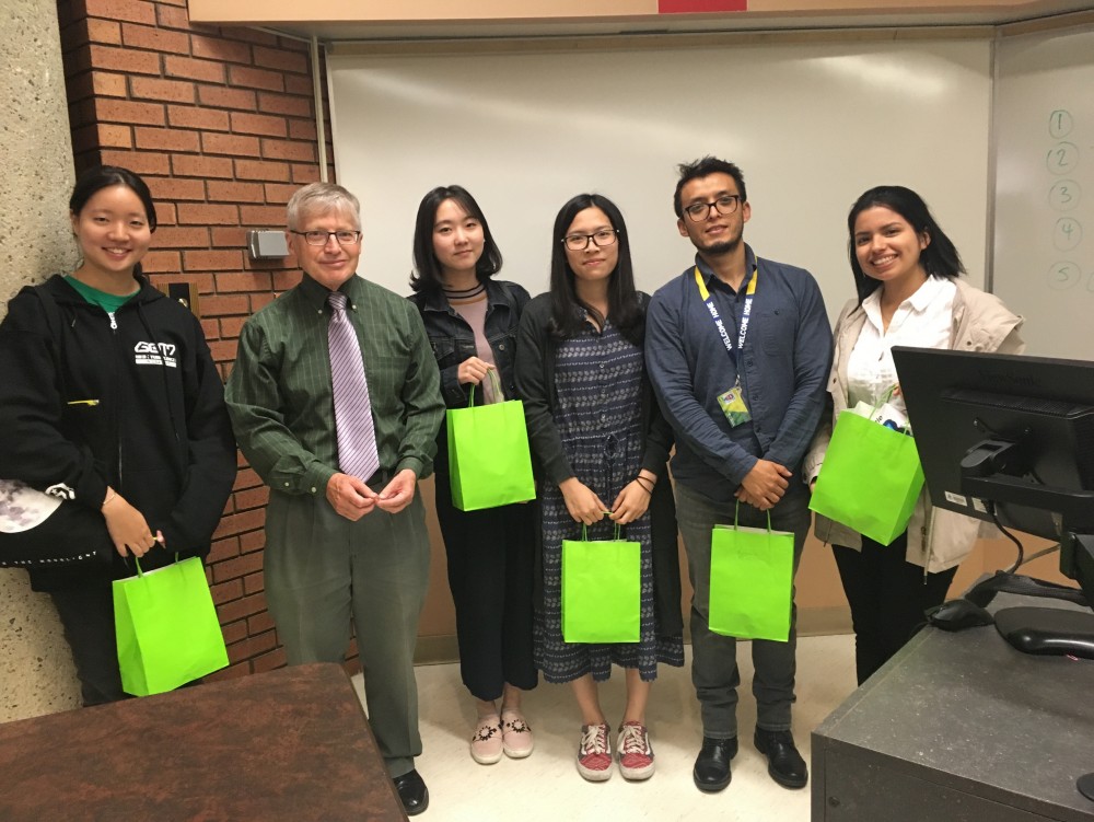 The top students receive awards from Prof. John Doyle