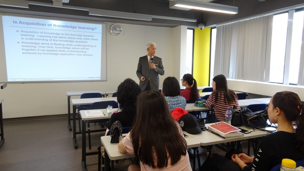 Mr. Horace Ho discussing with students